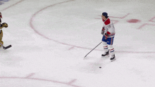 a hockey game is being played in front of a sports experts sign