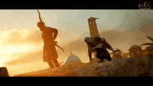 a man with a bow and arrow is standing next to another man
