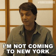 a man says i 'm not coming to new york with his eyes closed