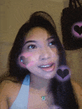 a woman with hearts on her face and a purse in the background
