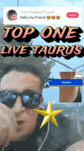 a man wearing sunglasses stands in front of a poster that says top one live taurus