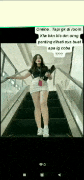 a woman in a short skirt is standing on a set of escalators with a text message behind her .