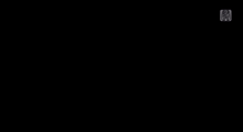 a girl in a clown costume is standing under a spotlight and saying hello .