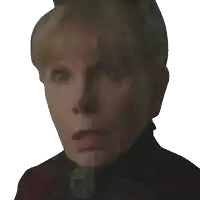 a close up of an older woman 's face with a very surprised look on her face