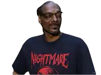 snoop dogg is wearing a nightmare t-shirt