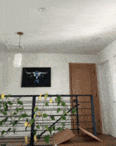 a painting of a bull hangs above a railing