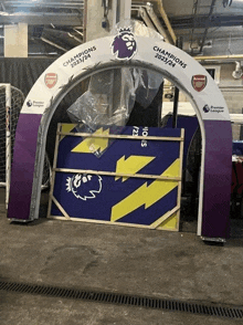 a purple and yellow sign that says champions 2021/24