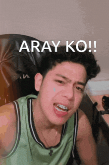 a young man with braces on his teeth is making a funny face with the words aray ko written above him