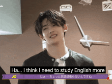 a young man says ha i think i need to study english more in front of a large clock