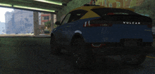 a blue and yellow car with the word vulcar on the back