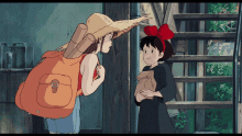 a girl with a red bow on her head is talking to another girl with a backpack