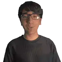 a man wearing glasses and a black shirt that says nicholas on it