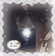 a picture of a woman taking a picture of herself with riki de mey written on the bottom