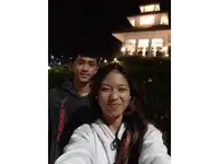 a man and a woman are posing for a selfie and the man is wearing a hoodie that says beyond