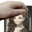 a hand is holding a picture of a girl with a headset on .