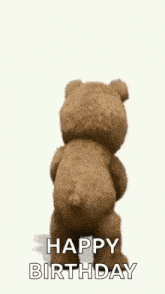 a teddy bear is holding a book and dancing while saying `` happy birthday '' .