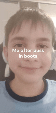 a young boy wearing headphones and a blue shirt with the words me after puss in boots