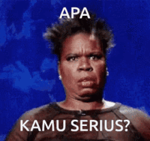 a woman with a serious look on her face and the words apa kamu serious