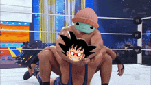 a wrestler is carrying another wrestler on his back