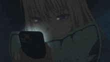 a girl with purple eyes is looking at a cell phone
