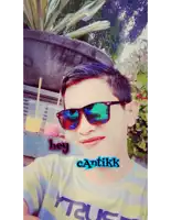a young man wearing sunglasses and a shirt that says true