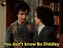 two men are standing next to each other and one of them is saying " you don t know bo diddley "