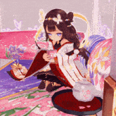 a girl in a kimono is sitting on a couch reading a book