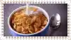 a bowl of cereal with milk being poured into it .