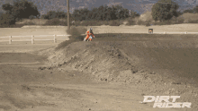 dirt rider is written on the bottom of a dirt road
