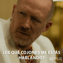 a man with a beard and tie says " de que cojones me estas hablando " in spanish