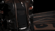 a man in armor is holding a gun with a cancel button below it
