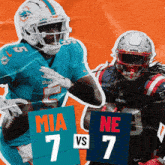 a miami dolphins player and a new england patriots player are playing football