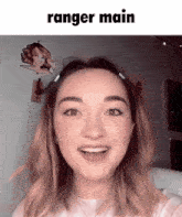 a girl with a ranger main sticker on her head