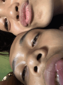 a close up of a person 's face with their tongue out
