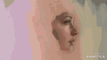 a person is painting a woman 's face with a white brush