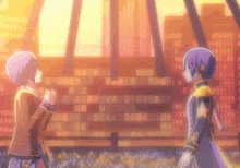 a couple of anime characters are standing next to each other in front of a crowd .