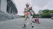 a person in a costume with a red belt that says ' king ' on it