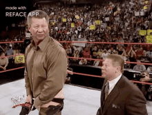 two men are standing in a wrestling ring with a reface app watermark on the bottom