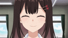 a girl with two red flowers in her hair smiles
