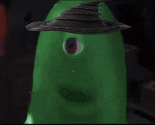 a green monster with a witch hat on