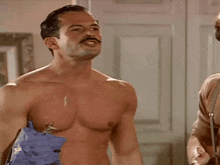 a shirtless man with a mustache is standing next to another shirtless man