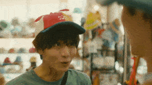 a boy wearing a hat that says ' i 'm a pirate ' on it