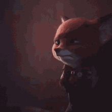 a close up of a red fox 's face in a dark room