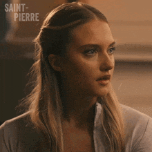 a woman says " who 's asking " in front of saint pierre
