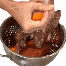washing sweet potatoes the whole food plant based cooking show rinsing sweet potatoes rubbing the dirt off the sweet potatoes preparing food
