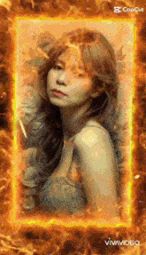 a woman in a blue dress is surrounded by flames and flowers ..