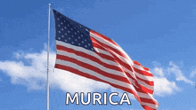 a large american flag is waving in the wind with the word murica written below it