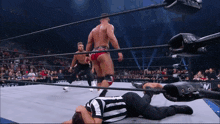 a referee is laying on the ground during a match