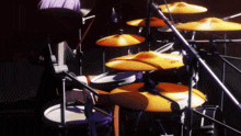 a person is playing a drum set with a cymbal that says ' a ' on it
