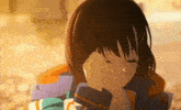 a close up of a girl with her hand on her face